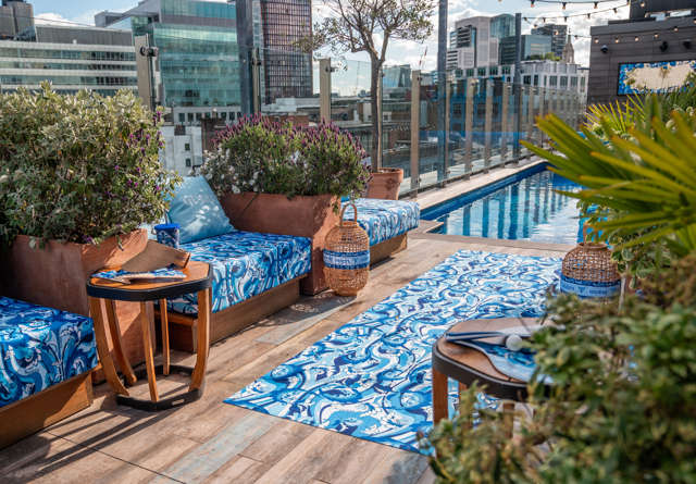 Rooftop pool at Marlins on the Roof venue with comfortable lounge seating.